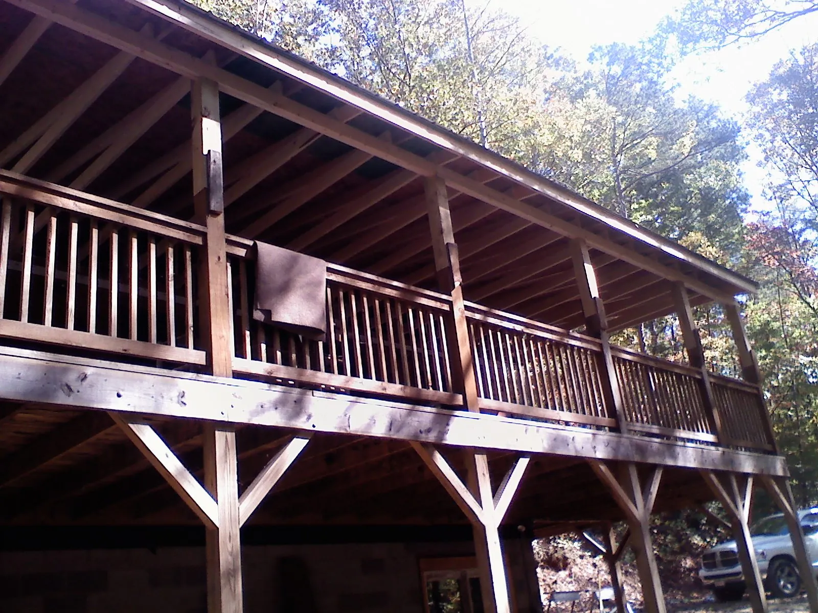 Timber framing under a new elevated porch and deck — Roof Leak Repair in Wood River by Roofing Brothers